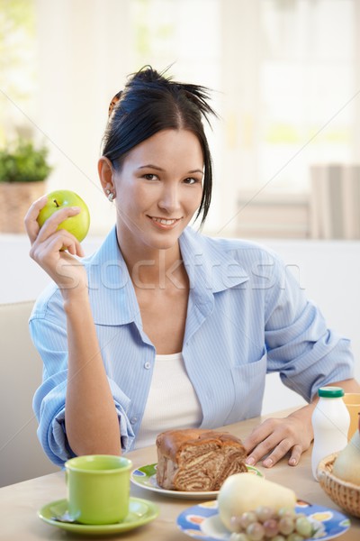 Young woman at breakfast with apple Stock photo © nyul