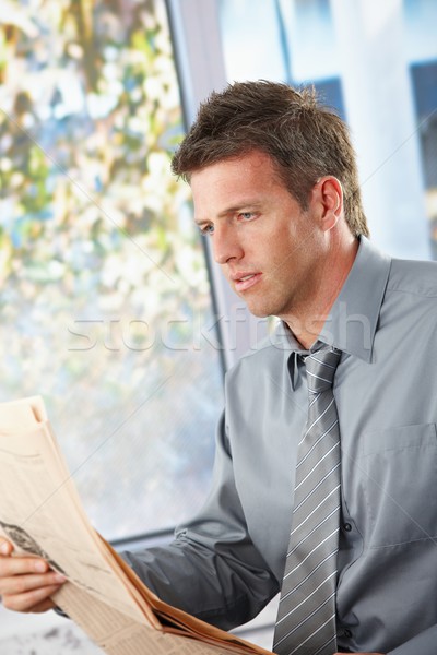 Businessman reading newspaper Stock photo © nyul