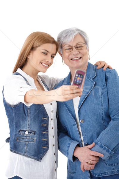 Mother and daughter taking photo of themselves Stock photo © nyul