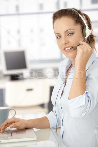 Pretty dispatcher working in bright office smiling Stock photo © nyul