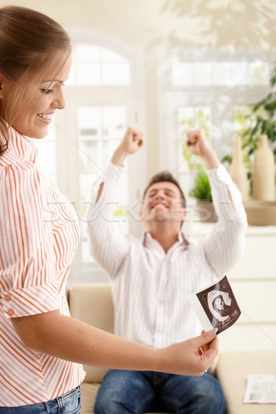 Smiling parents with ultrasound baby image Stock photo © nyul