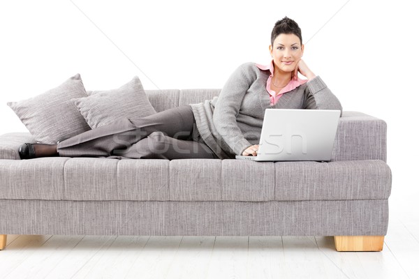 Kadın çalışma kanepe ev dizüstü bilgisayar yalıtılmış Stok fotoğraf © nyul