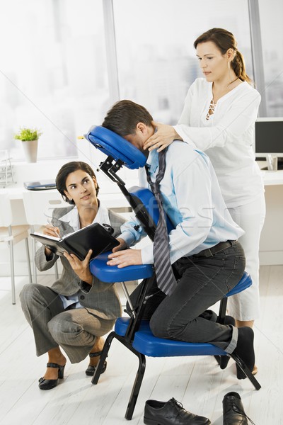 Busy executive getting massage in office Stock photo © nyul