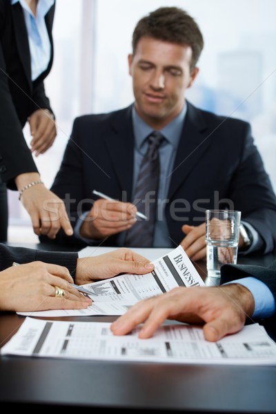 Businesspeople reviewing business report Stock photo © nyul