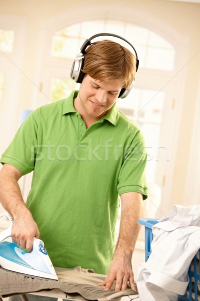 Guy ironing clothes Stock photo © nyul