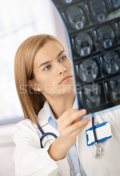 Attractive radiologist analysing x-ray image Stock photo © nyul