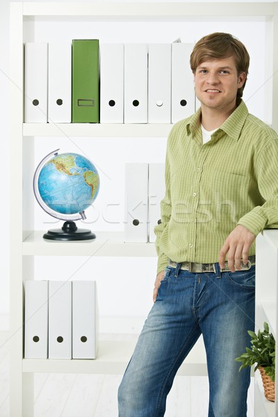Young man in green office Stock photo © nyul