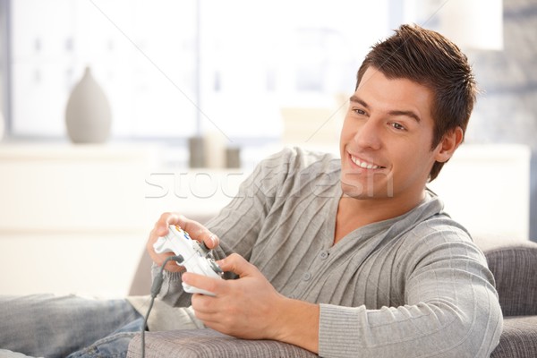 Young guy enjoying computer game Stock photo © nyul