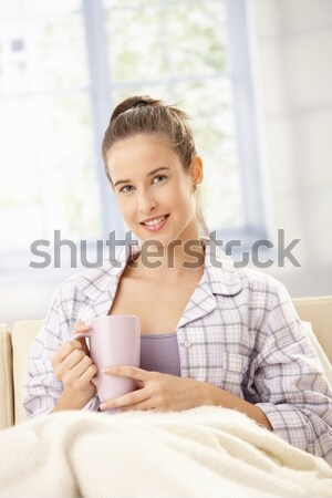 Aantrekkelijke vrouw ochtend drinken koffie heldere woonkamer Stockfoto © nyul