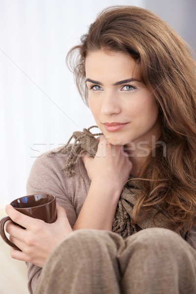 Stock photo: Beautiful woman drinking tea at home