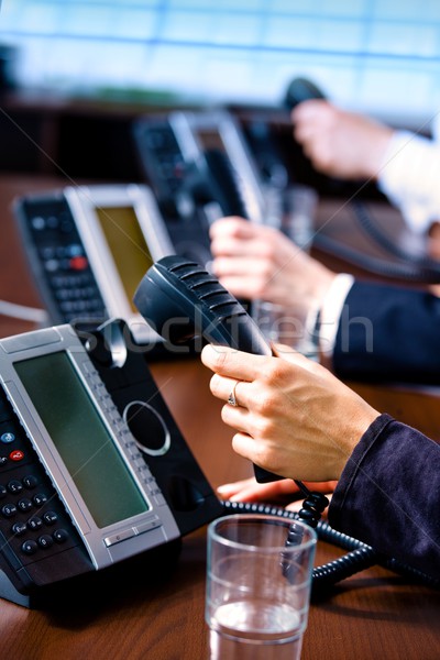 Hands holding phones Stock photo © nyul