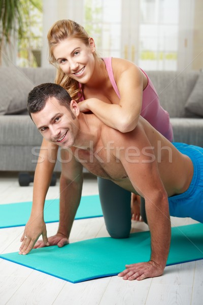 Stock photo: Happy couple doing push ups