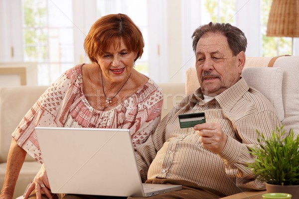 Elderly couple shopping online Stock photo © nyul