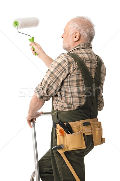 Senior man painting wall Stock photo © nyul