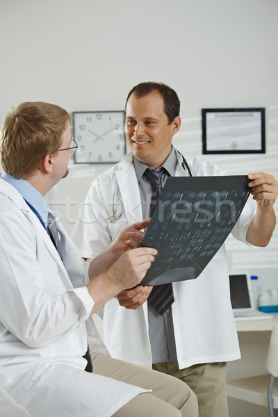 Doctors consluting diagnosis Stock photo © nyul