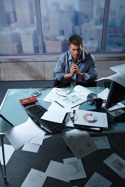 Tired businessman with papers all around Stock photo © nyul