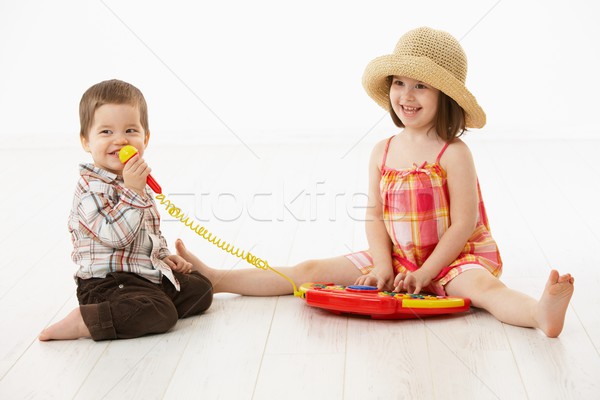 Little children playing with toy instrument Stock photo © nyul