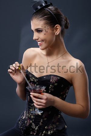 [[stock_photo]]: Femme · robe · de · cocktail · belle · jeune · femme · posant · mains
