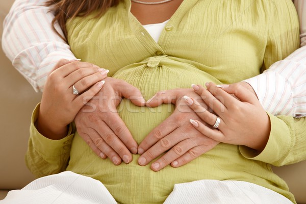 Hände schwanger Bauch Vater Frau halten Stock foto © nyul