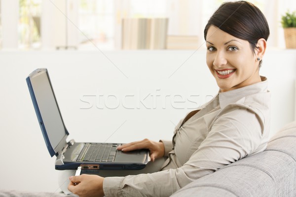 Nő drótnélküli hálózat otthon fiatal nő modem Stock fotó © nyul