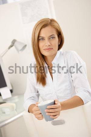 Daydreaming woman with coffee mug Stock photo © nyul