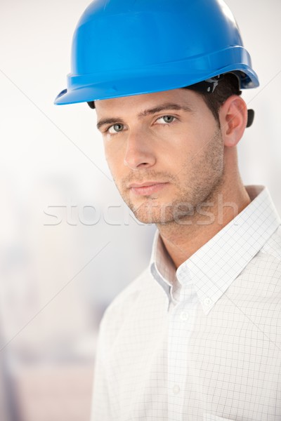 Stock photo: Portrait of goodlooking young man in helmet�