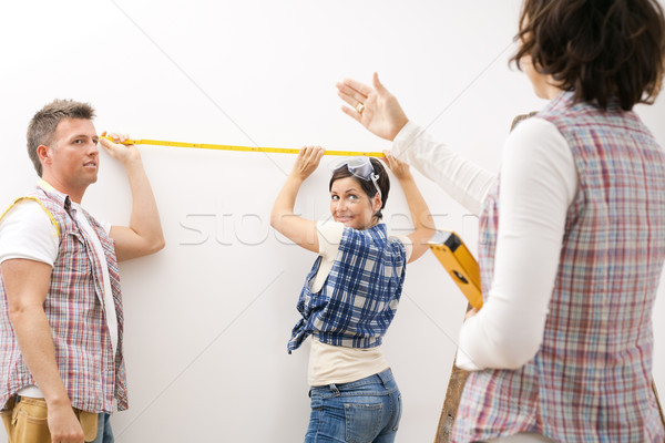 Couple holding measuring stick Stock photo © nyul