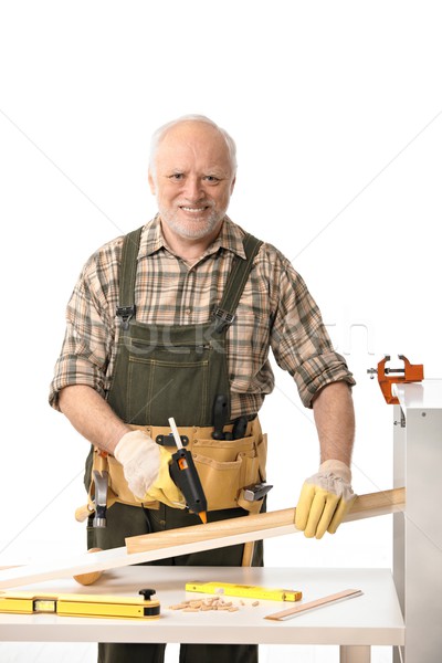 Cheerful elderly man tinkering Stock photo © nyul