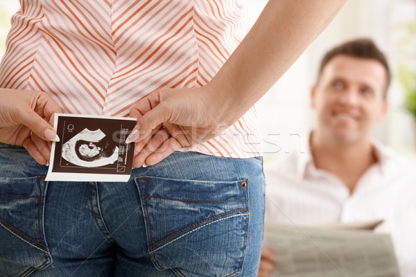 Woman holding ultrasound image Stock photo © nyul