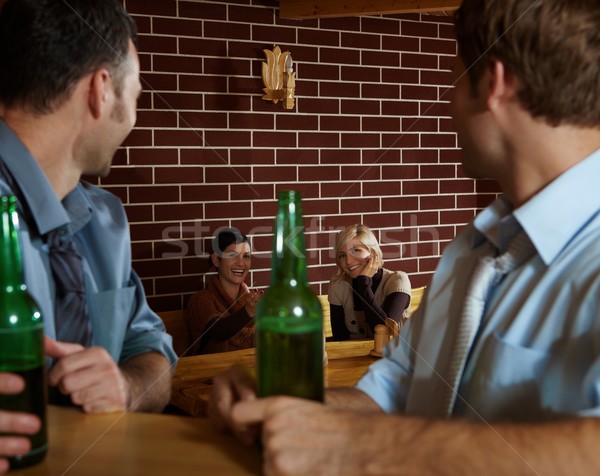 Jongeren bar vergadering jonge mannen naar glimlachend Stockfoto © nyul