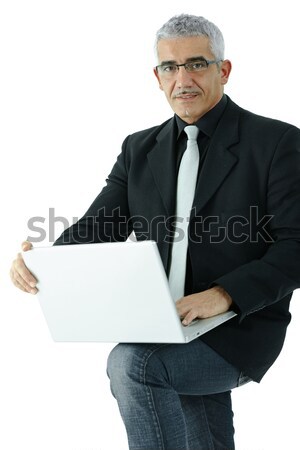 Foto stock: Empresário · usando · laptop · maduro · em · pé · computador · portátil