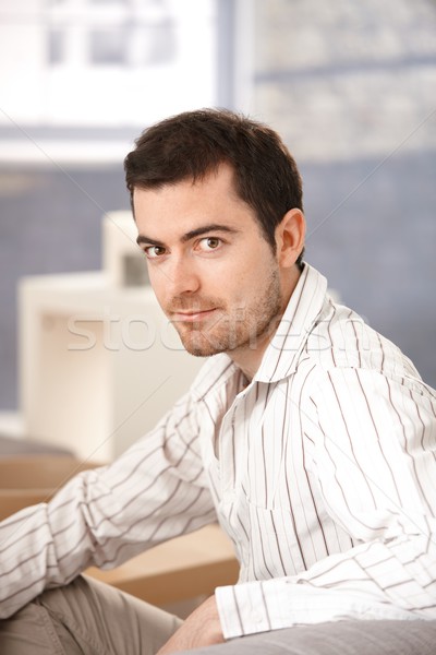 Portrait of young man sitting at home Stock photo © nyul