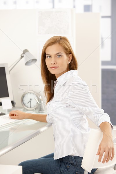 Confident office girl at desk Stock photo © nyul