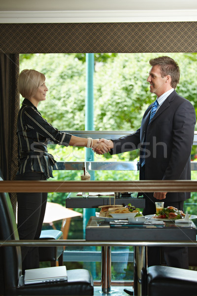 Stock photo: Business greating in cafe