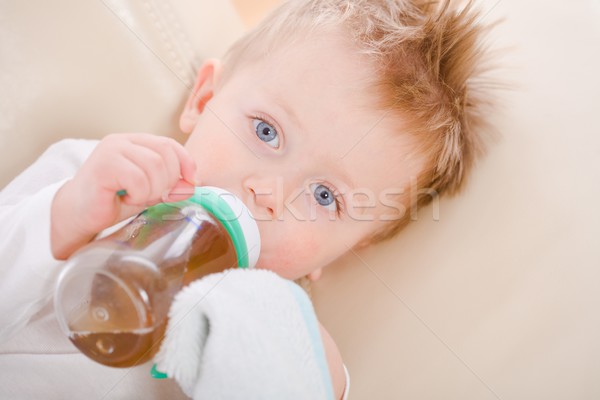 Baby boy drinking from bottle Stock photo © nyul