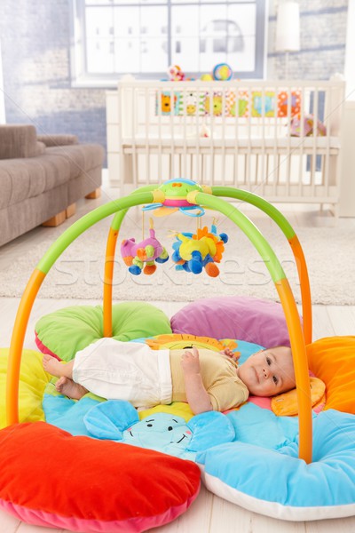 Happy baby on playmat Stock photo © nyul