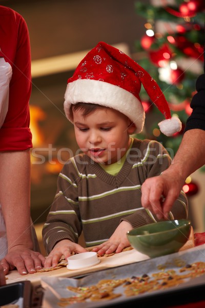 Small boy in santa claus hat at christmas baking Stock photo © nyul