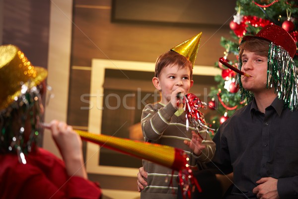 Happy family celebrating new year's eve together Stock photo © nyul