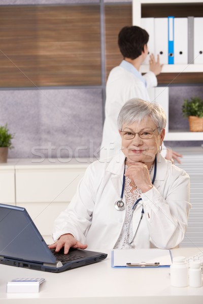 Stock photo: Smiling doctor with assistant