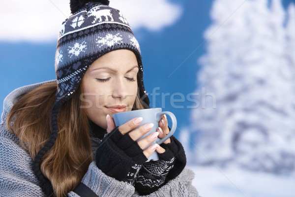 Pretty girl drinking hot tea in winter eyes closed Stock photo © nyul