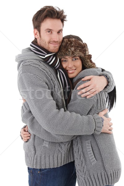 Loving couple cuddling up to each other smiling Stock photo © nyul