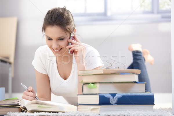 Pretty girl chatting on mobile smiling Stock photo © nyul