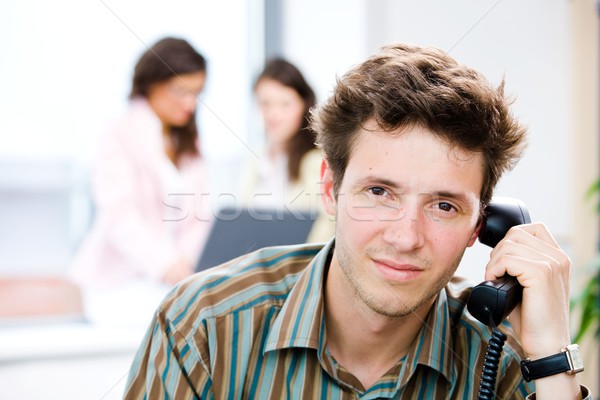 Businessman with phone at office Stock photo © nyul