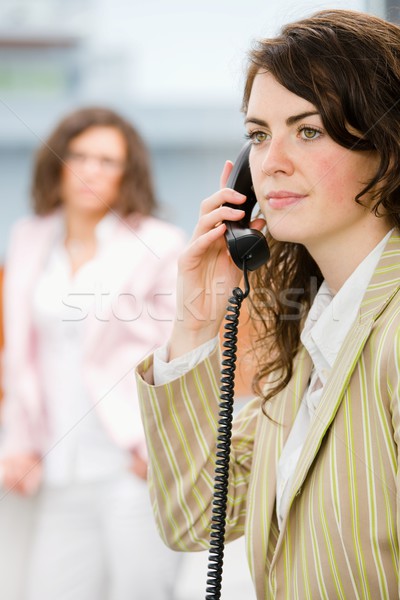 Receptionist telefono imprenditrici ufficio chiamando faccia Foto d'archivio © nyul