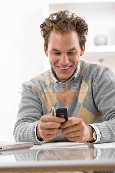 Young man using phone Stock photo © nyul