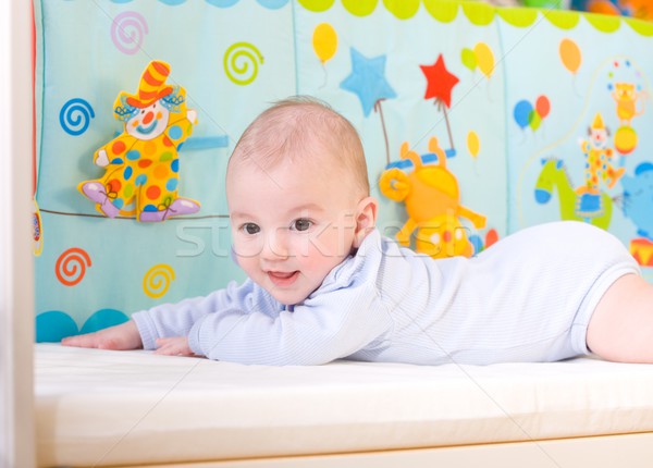 Smiling baby in bed Stock photo © nyul