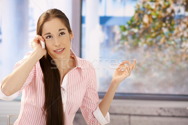 Girl concentrating on phone call Stock photo © nyul