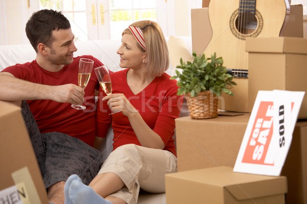 Happy couple celebrating end of moving Stock photo © nyul