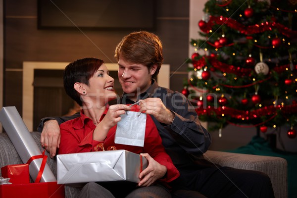 Stock photo: Happy couple giving christmas presents