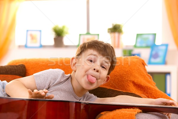 Five year old boy putting out tongue for pose Stock photo © nyul